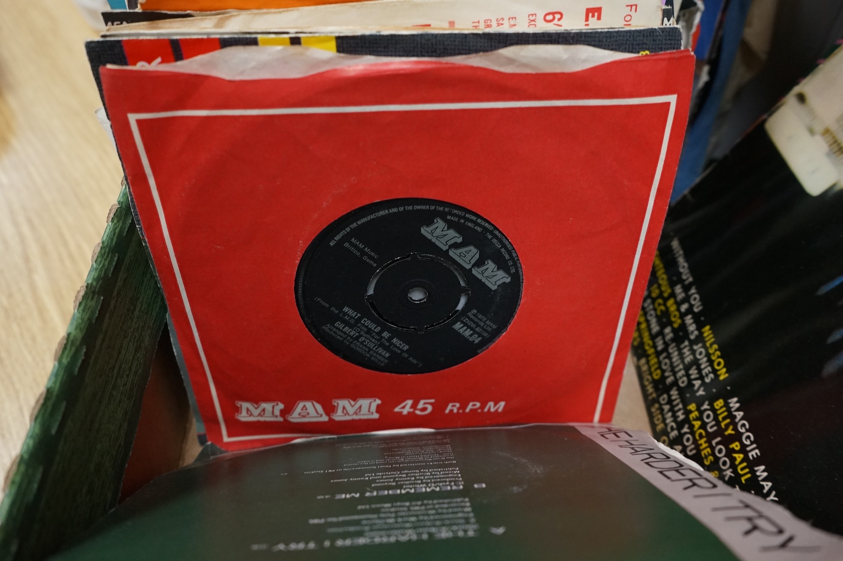 A collection of LP record albums, 12” singles and 7” singles, artists include; Dire Straits, Queen, ELO, Michael Jackson, etc.